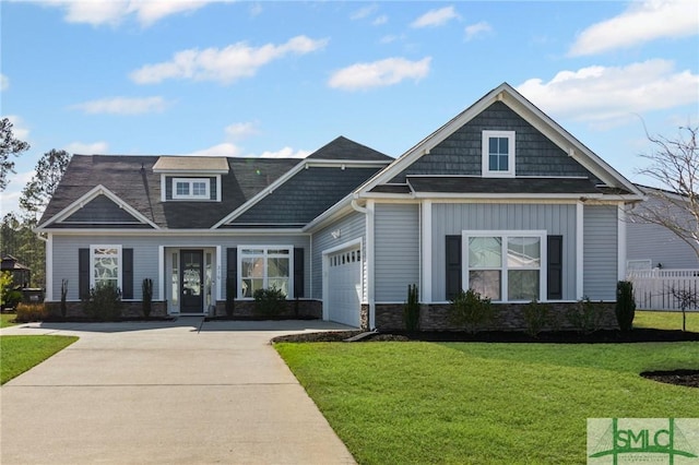 craftsman-style home with a garage and a front yard