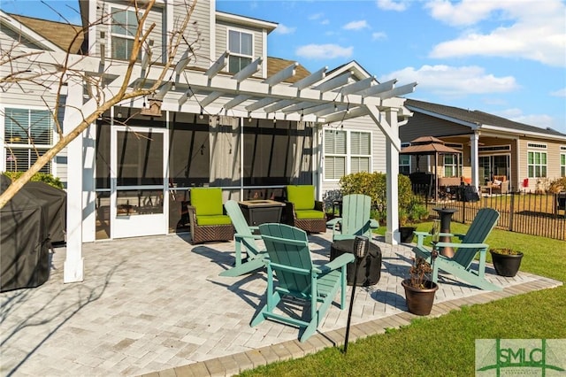 view of patio with a sunroom and a pergola