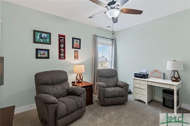 office featuring ceiling fan and light colored carpet