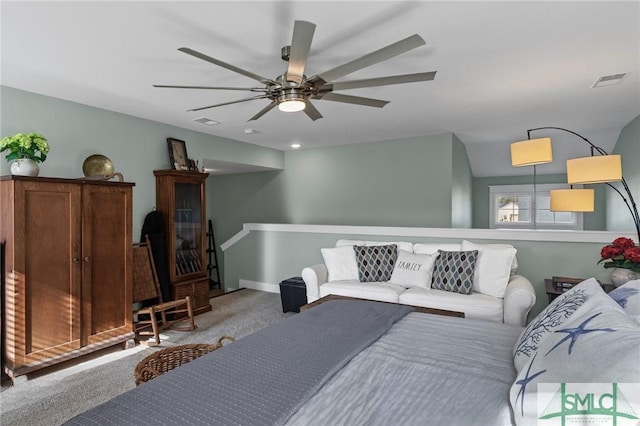 carpeted living room with ceiling fan