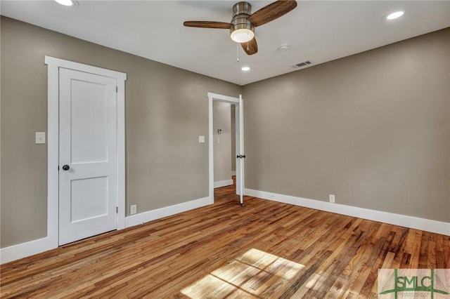 unfurnished room with ceiling fan and light hardwood / wood-style floors