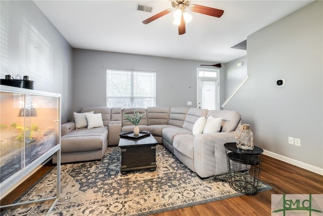 living room with hardwood / wood-style flooring and ceiling fan