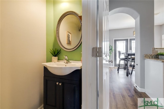 bathroom featuring vanity and hardwood / wood-style floors