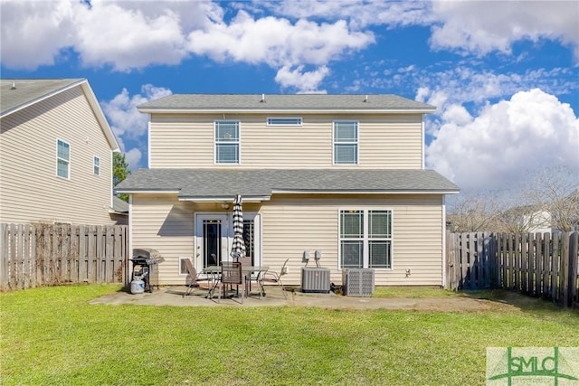 back of house with central AC, a patio, and a lawn