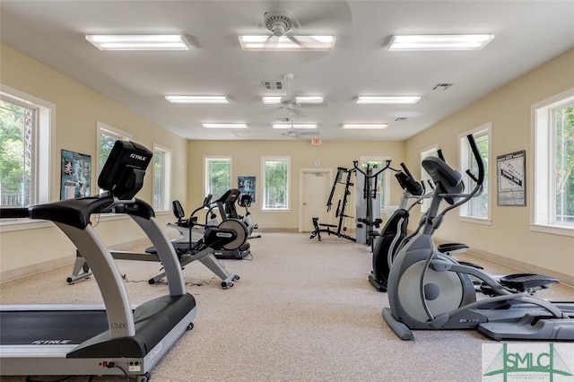 exercise room featuring light colored carpet and ceiling fan