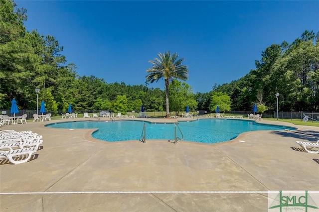 view of pool featuring a patio area