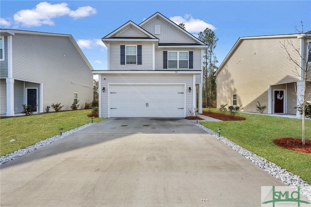 view of front of house featuring a front yard and a garage