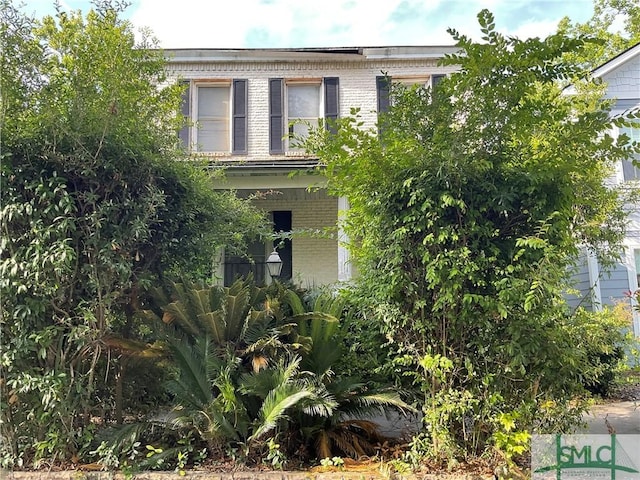 view of front of home featuring brick siding