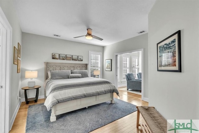 bedroom featuring light hardwood / wood-style flooring and ceiling fan