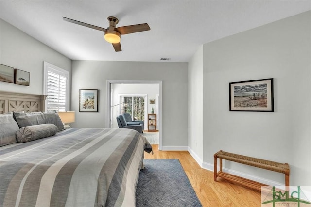 bedroom with light wood-type flooring and ceiling fan