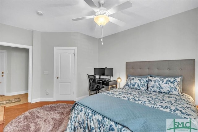 bedroom featuring hardwood / wood-style floors and ceiling fan