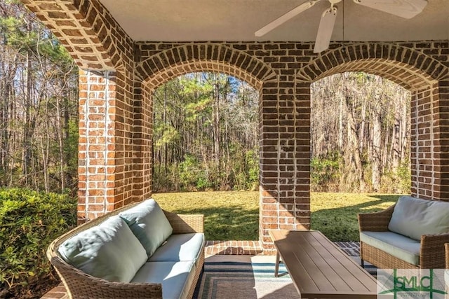 view of patio featuring ceiling fan