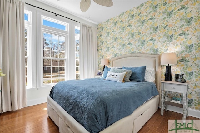 bedroom featuring hardwood / wood-style flooring and ceiling fan