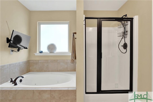 bathroom with shower with separate bathtub