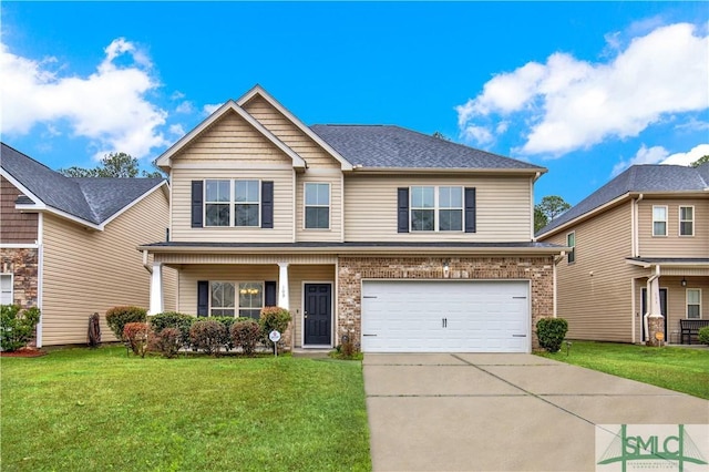 view of front of house with a garage and a front yard