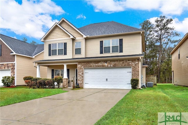 view of front facade featuring a front yard, a garage, cooling unit, and a porch