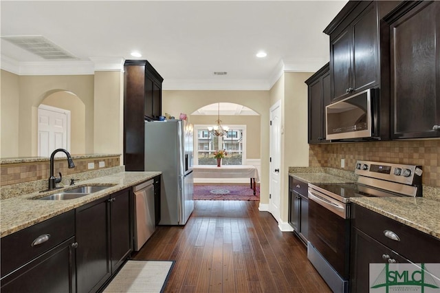 kitchen featuring sink, appliances with stainless steel finishes, light stone countertops, and dark hardwood / wood-style flooring