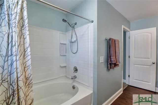 bathroom with hardwood / wood-style floors and shower / bathtub combination with curtain