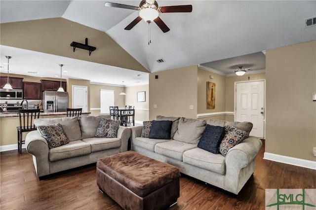 living room featuring ceiling fan, vaulted ceiling, crown molding, and dark hardwood / wood-style flooring