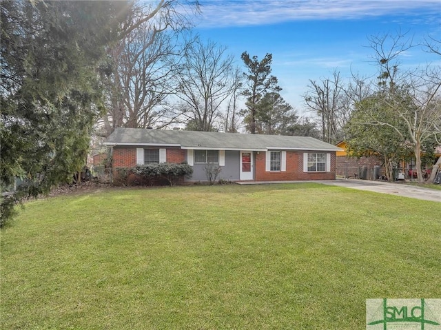 ranch-style home featuring a front yard