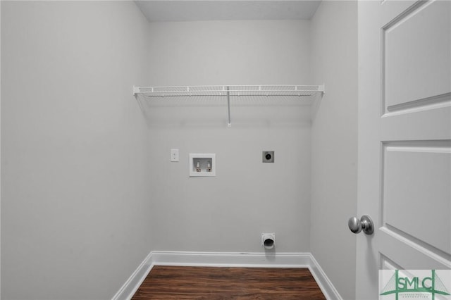 clothes washing area featuring dark wood-style floors, hookup for a washing machine, hookup for an electric dryer, laundry area, and baseboards