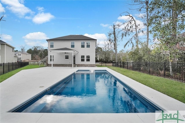 back of property featuring a yard, a patio, a fenced backyard, and a fenced in pool