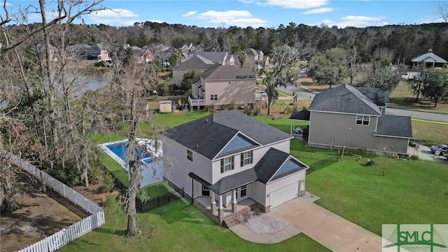 birds eye view of property with a residential view