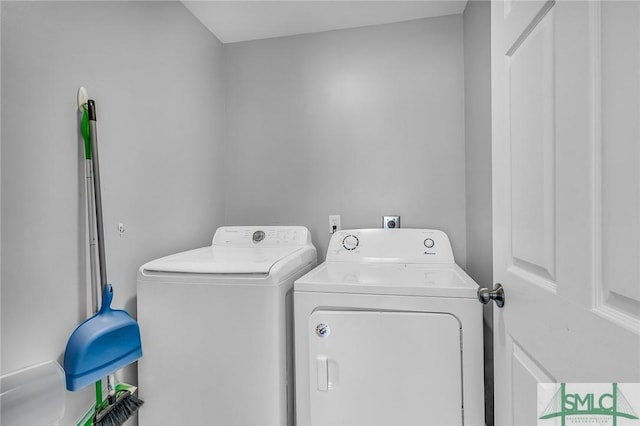 washroom with washer and dryer