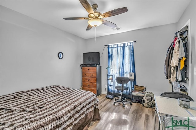 bedroom featuring ceiling fan and light hardwood / wood-style flooring