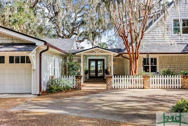 entrance to property with french doors and a garage