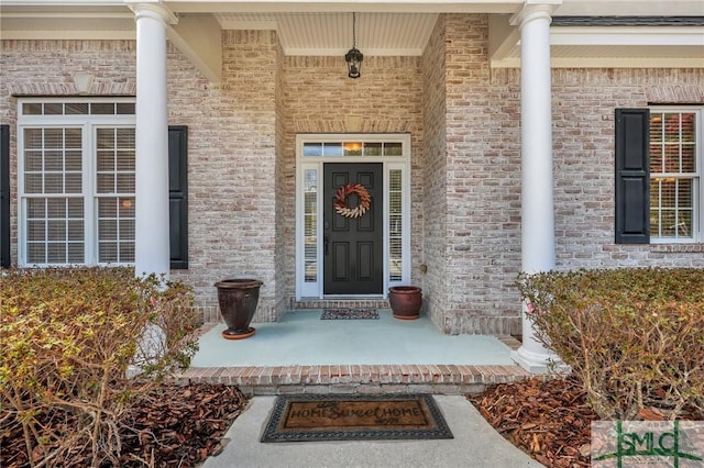 doorway to property with a porch