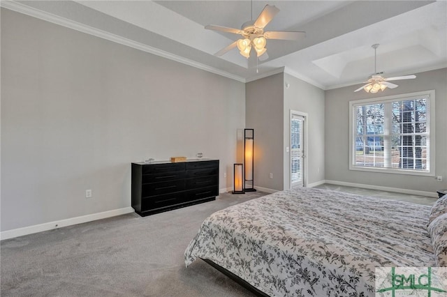 carpeted bedroom featuring crown molding, ceiling fan, and a raised ceiling