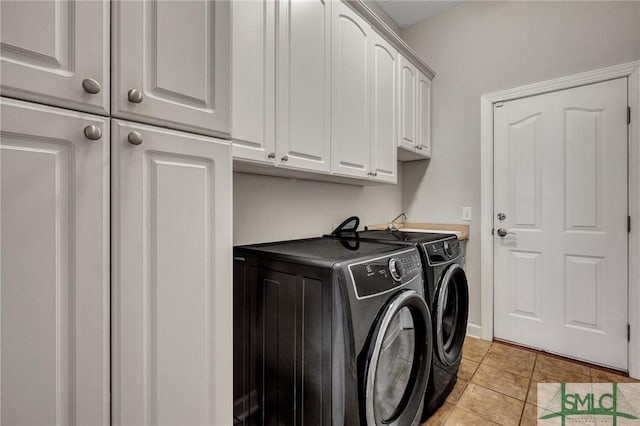 laundry room featuring cabinets and independent washer and dryer