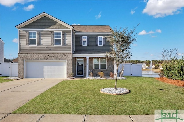 view of front of home featuring a front lawn and a garage