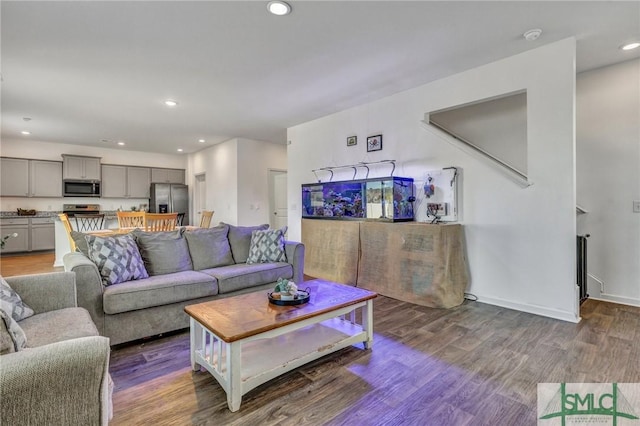 living room featuring dark wood-type flooring