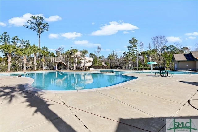 view of swimming pool featuring a patio