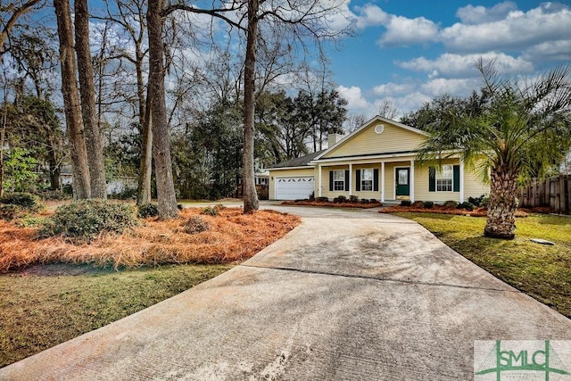 view of front of property with a garage and a front lawn