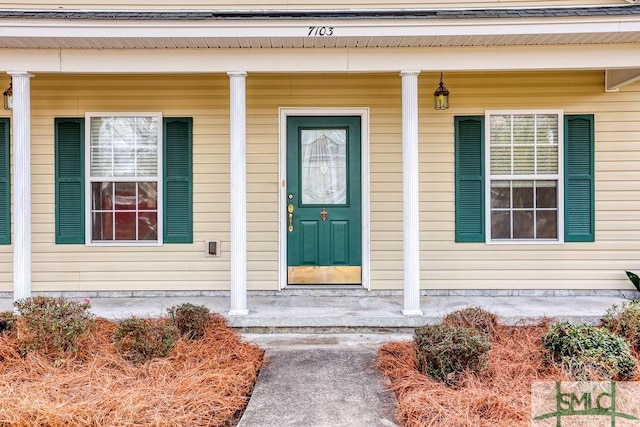 entrance to property with a porch