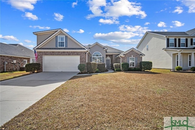 view of front of home with a garage and a front lawn