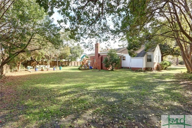 view of yard with a playground, a storage shed, and an outdoor hangout area