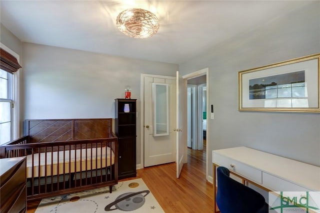 bedroom with light wood-type flooring