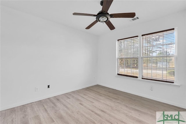 empty room featuring ceiling fan and light hardwood / wood-style flooring