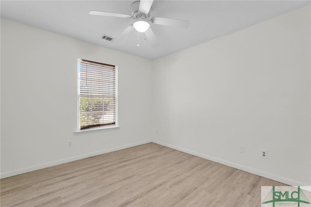 empty room featuring light wood-type flooring and ceiling fan