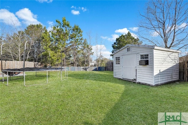 view of yard with a storage unit and a trampoline