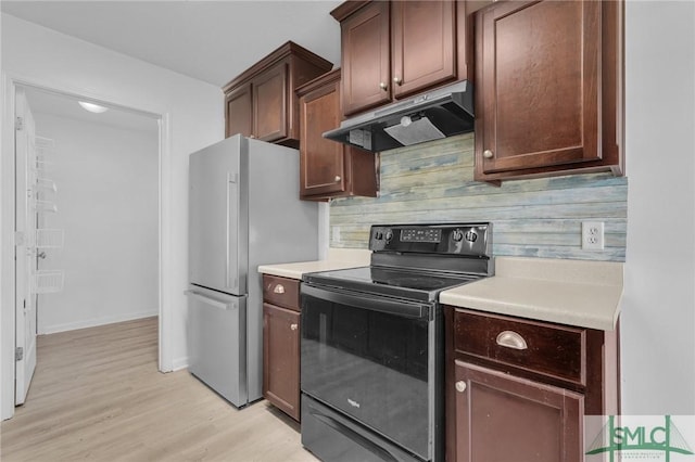 kitchen with light wood-type flooring, dark brown cabinetry, stainless steel refrigerator, black electric range oven, and decorative backsplash