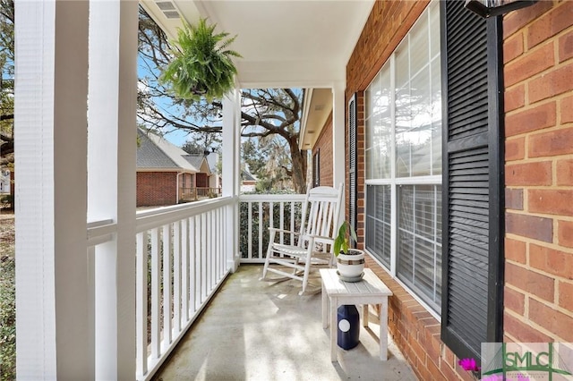 balcony featuring a porch