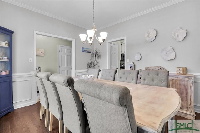 352 Harbour Ln, Richmond Hill, GA 31324 - dining space with ornamental molding, wainscoting, a notable chandelier, and dark wood finished floors
