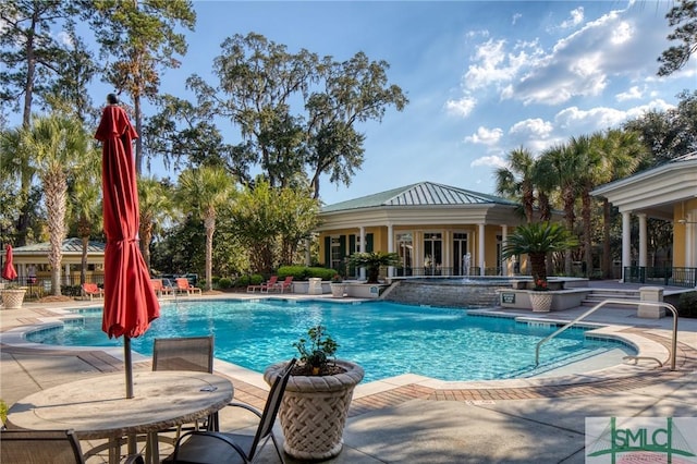 view of pool with a patio area