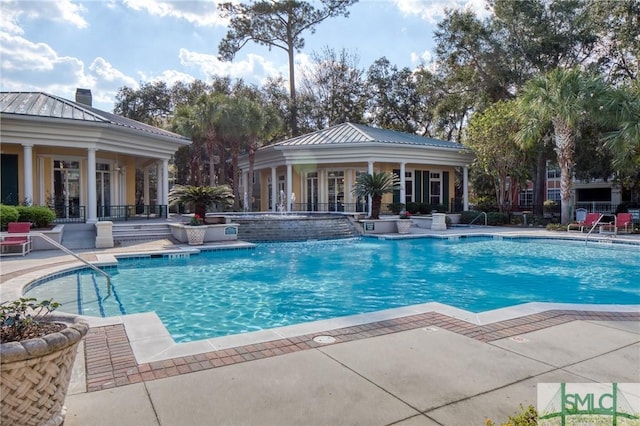 view of swimming pool with a patio