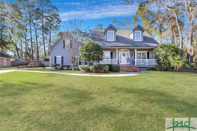 cape cod home with a front lawn and covered porch